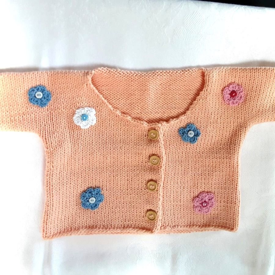 Bio Strickjacke Baby in Apricot und der Größe 80/86 - Shop Pekusch